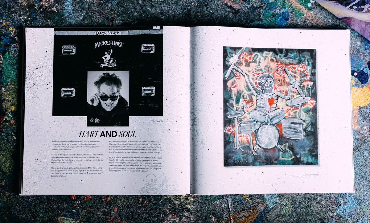 Open book with a page featuring an illustration of a person and another of a skeleton playing drums, on a textured surface.