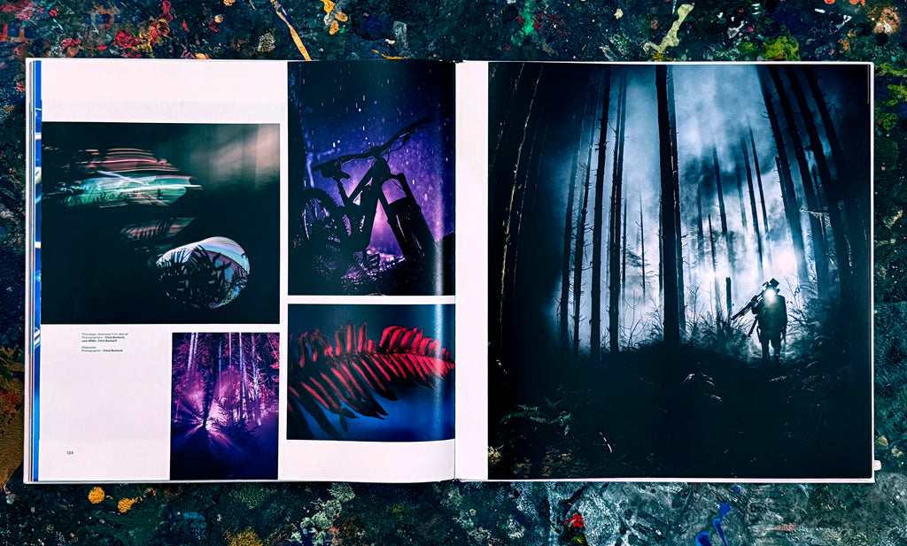 Open book with dark-themed illustrations on a textured surface