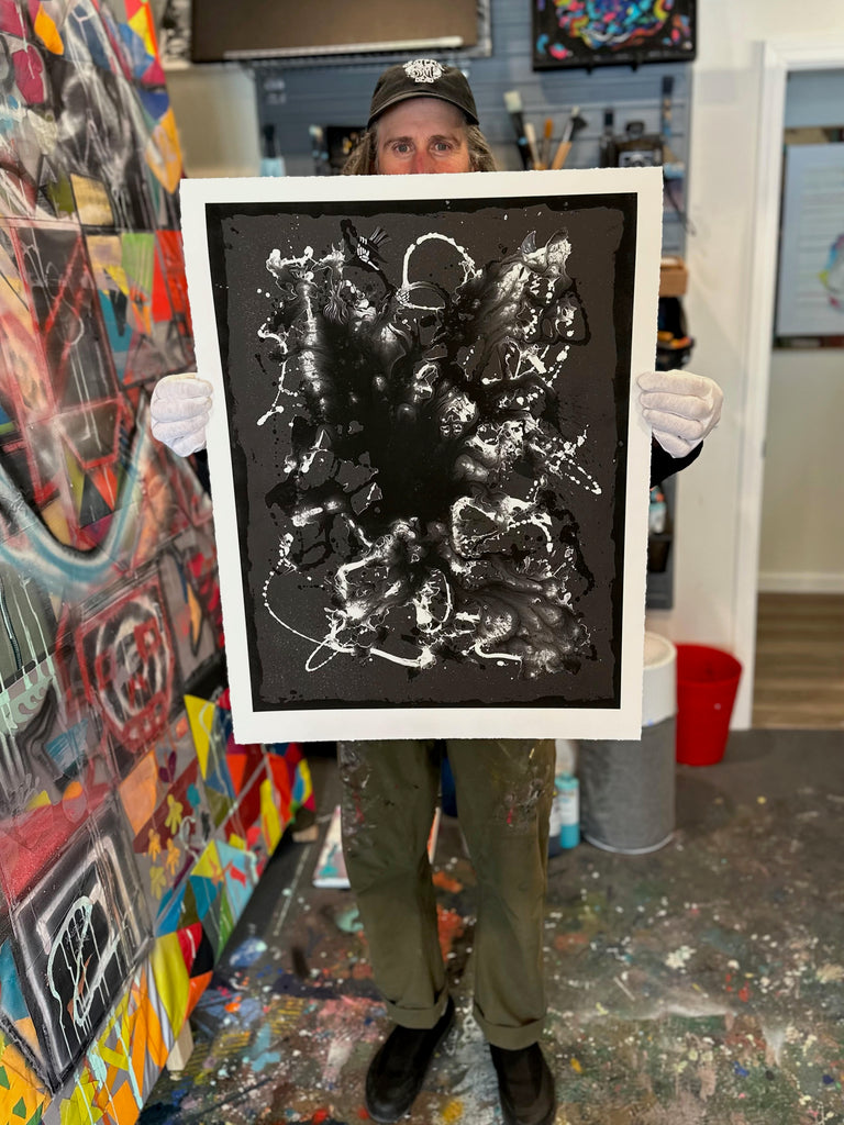 Chris in his studio holding the Uncle Bill Limited Release Print